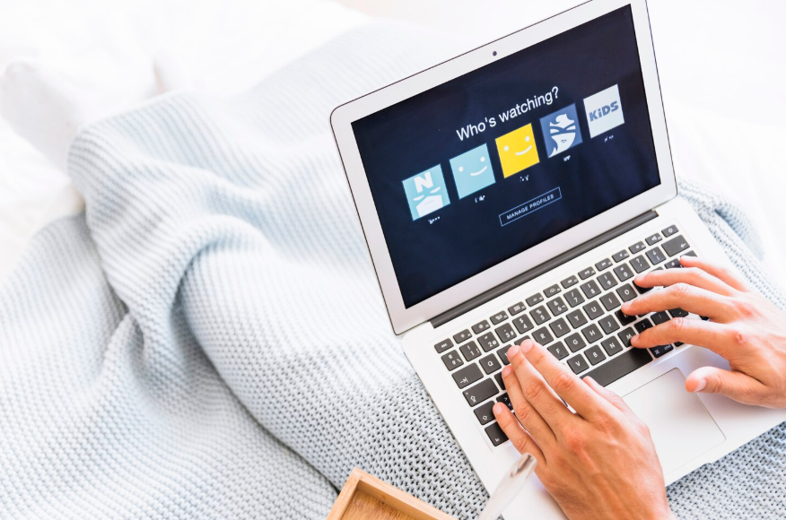Laptop showing shared profiles for how to split streaming costs at home.