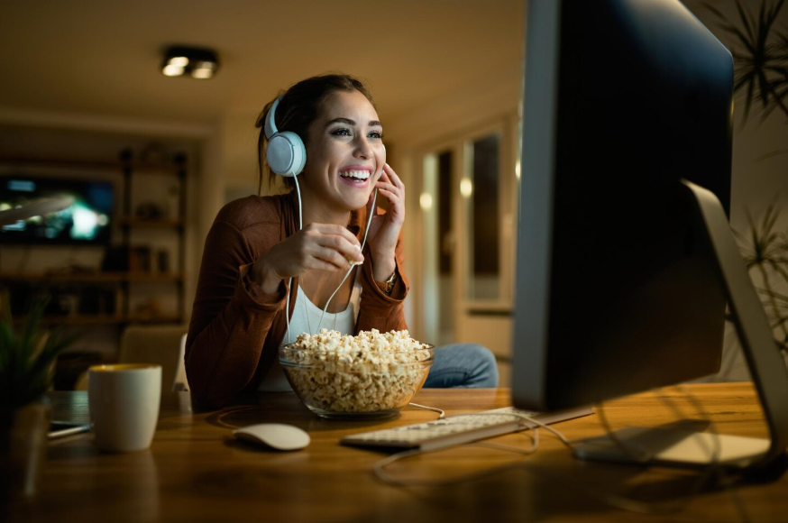 User comparing streaming vs digital rentals on a desktop to choose what to watch.