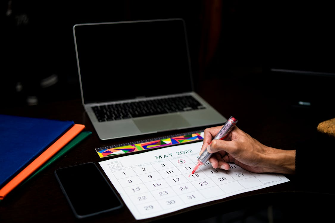Hand-marking a calendar to avoid auto-renewal charges on streaming subscriptions.