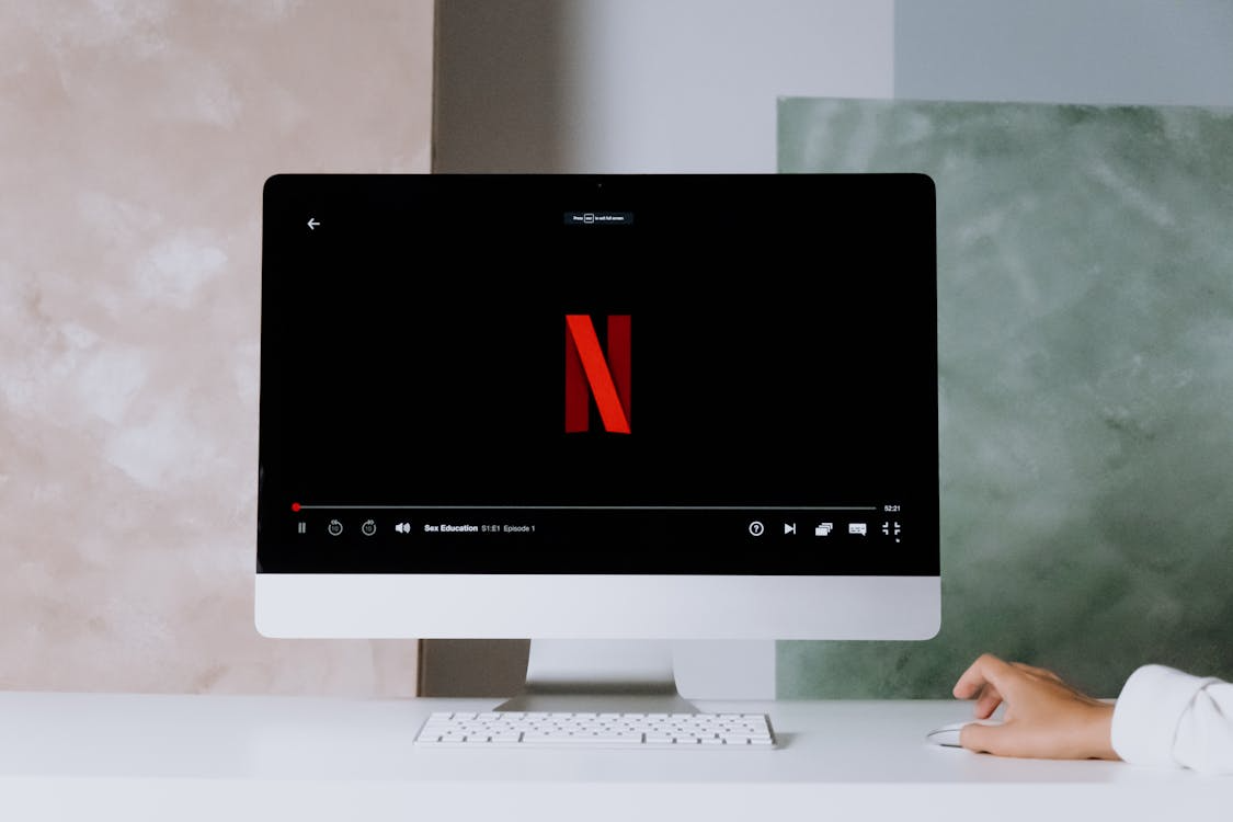 User simplifying streaming services on a desktop to keep streaming services you actually need.