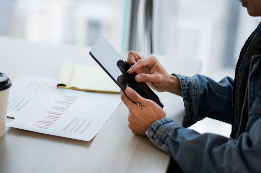 Checking a phone to track streaming price increases before higher charges hit the bill.