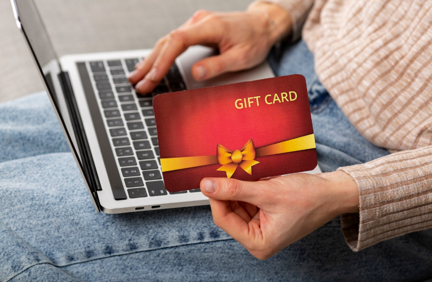 User using streaming gift card deals on a laptop to lower subscription costs.