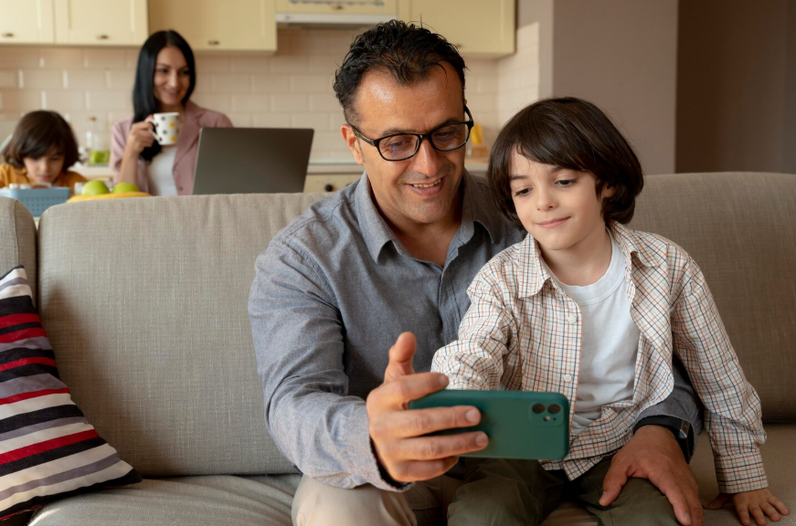 Parent setting parental controls for streaming costs on a phone to manage household purchases.