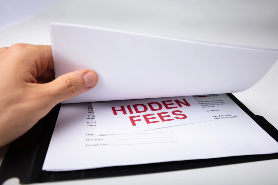 Hand revealing hidden fees in streaming services and cable bundle contracts.